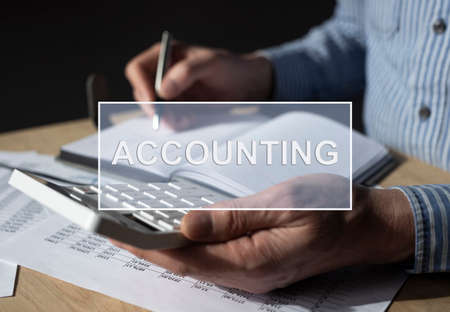 Businessman working with financial documents, accounting statistics. Tax calculations and budget concept.の写真素材