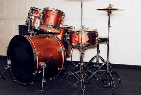 Drumkit in red and silver colors with drums and cymbals.の写真素材