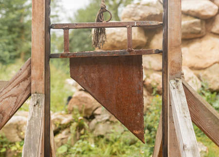 Guillotine, medieval decapitated equipment for punishment, blade closeup.の写真素材