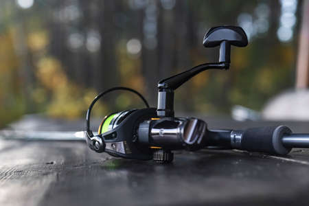 Reel of fishing rod closeup. Fishermans equipment.の写真素材