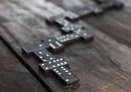 Domino pieces on wood table in order of game. Concept of way.の写真素材