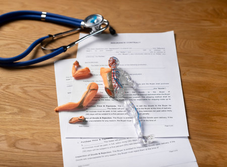 Health and life insurance concept. Medical contract with stethoscope.の写真素材