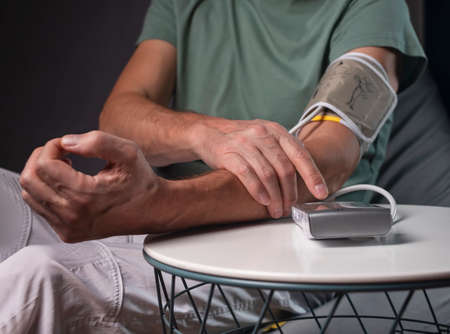 Blood pressure monitoring and checking concept. Close up