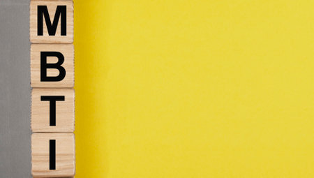 MBTI types test, letters on yellow and gray background with copy space for text.の写真素材