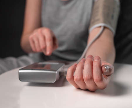 Blood pressure measuring and monitoring concept by young people.