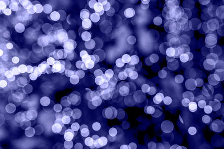 Very peri colored lights of Christmas garland. Violet very pery glowing.