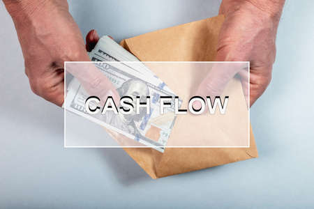Cash flow word. Cashflow of US dollars concept.の写真素材