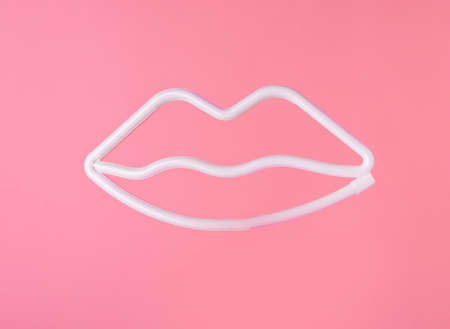 Lips outline on pink background. Valentines day concept. High quality photoの写真素材