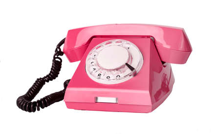 Pink retro phone isolated on white background. Telephone with rotary dial. High quality photoの写真素材
