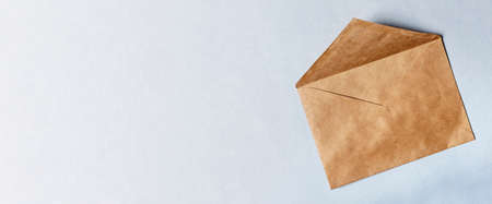 Banner containing craft paper envelope on white background. Copy space. High quality photoの写真素材