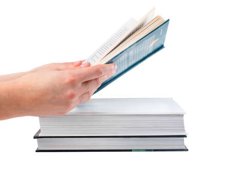 Reading book and education concept. Hands holding book isolated on white background. Books stack....