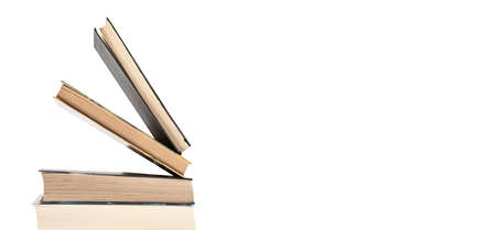 Banner with books stack isolated on white background. Education, preparing for exams, conducting research concept. Place for text. High quality photoの写真素材