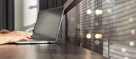 Banner with woman hands typing on laptop keyboard on window background. Place for text. Online...