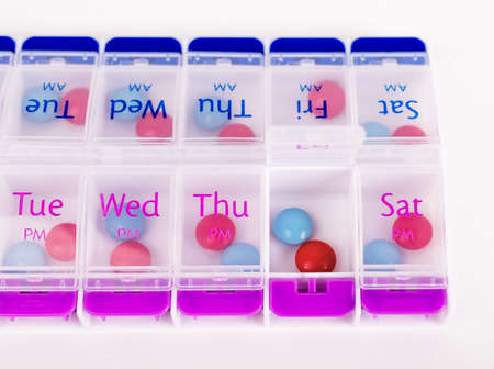 Weekly pills box for daily medication. Health care and pharmacy concept. High quality photoの写真素材