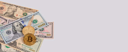 Banner with US dollars bills and bitcoin coins. Cryptocurrency at American money pile. Finance,...