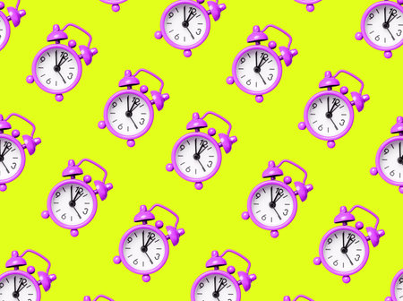 Vintage purple alarm clock pattern on yellow background. Time, accuracy concept. High quality photo