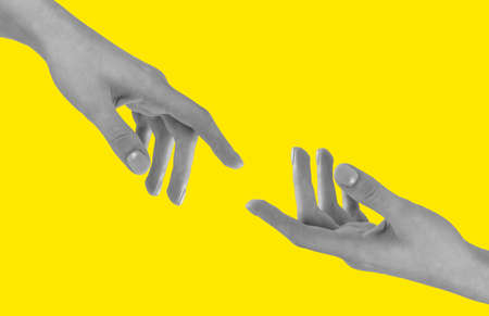 Helping hand. Support in hard time, friendship, sympathy, peace concept on yellow background. High...