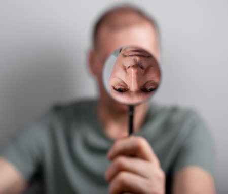 Man suffering from bipolar disorder, distorted self perception. High quality photoの写真素材