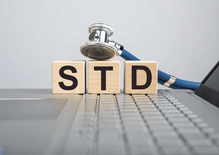 STD, medical disease abbreviation in doctor hands. High quality photoの写真素材