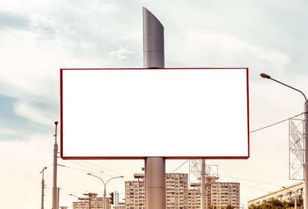 Big billboard mockup on city background with apartment building. Outdoor advertising poster. High quality photoの写真素材