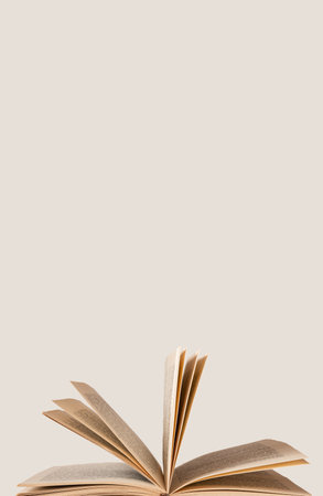 Vertical banner with open book. Turning pages. Intelligence, wisdom, study, reading concept. Place for text. high quality photoの写真素材