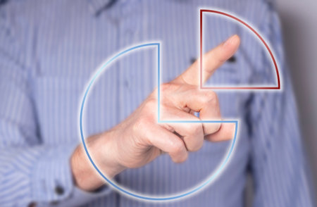 Man touching circular diagram at virtual screen. Tax, income percentage or dividends payment. budget allocation. high quality photoの写真素材