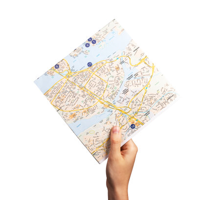 Hand holding map isolated on white background. Traveling, trip routes study, tourism concept. high...