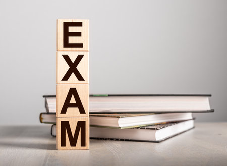 Exam word on cube on books. university examination. high quality photoの写真素材