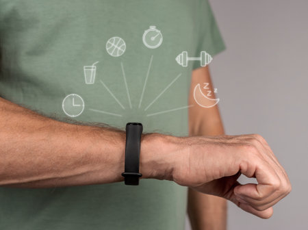 Fitness bracelet on hand, wrist of man closeup. Activity, sleep, gym workout, measure and control...