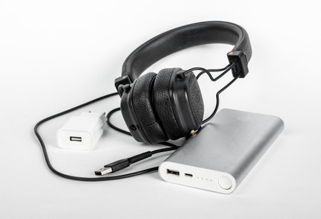 phone stuff for travel. Headphones, portable charger, cords, wires. high quality photo