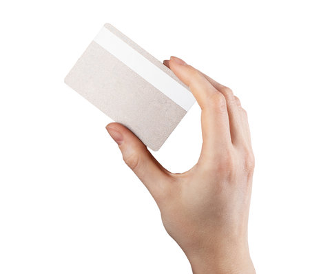Reverse side of bank card in hand. holding credit bankcard, back view isolated on white background. High quality photoの写真素材