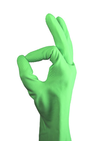 Hand in rubber glove showing OK sign, okay, approval symbol with fingers isolated on white background.の写真素材