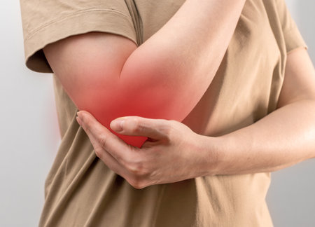 Elbow injury, pain, wound, trauma closeup. Contusion, hurt of arm joint.の写真素材
