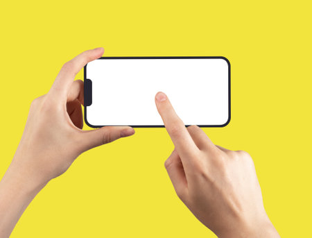 Berlin Germany May 14 2023 Smartphone iphone 14 frame screen mock-up, finger tapping on horizontal display.のeditorial素材