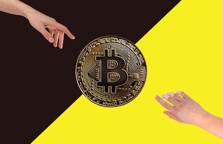 Bitcoin coins and hands. Crypto concept.