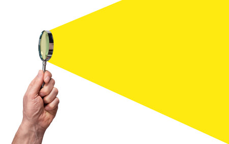 Hand holding magnifying glass, searching, researching, looking for insight. Banner.の写真素材