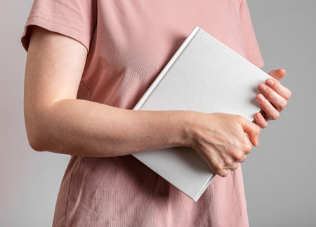 Hand holding book, abstract study literature.の写真素材