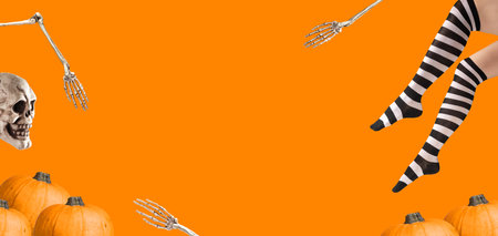 Halloween banner background with copy space for text. Funny Helloween ad with witch legs in stockings, pumpkin, skull.の写真素材