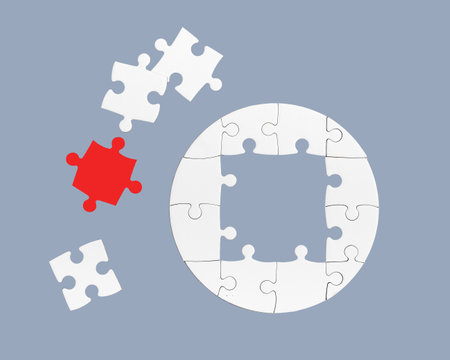 The missing link. Connecting the jigsaw pieces to form the whole picture.の写真素材