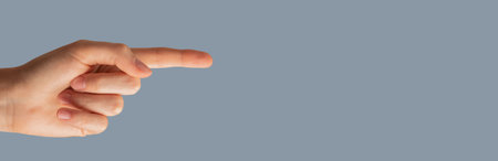 Hand showing something with index finger, banner backgroundの写真素材