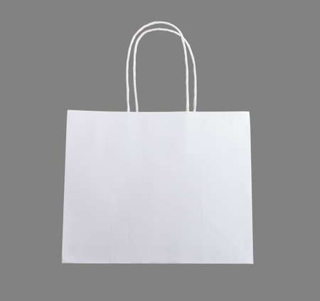 White paper bag with handles, paperbag mockup, isolated.の写真素材