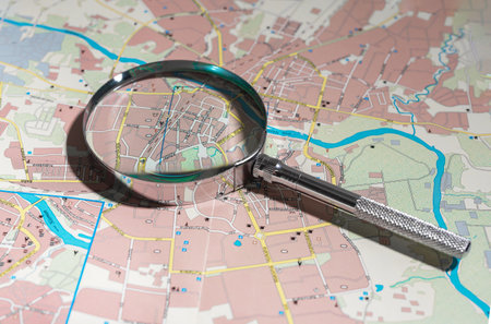 World map under magnifying glass, exploring new destinations. Travel and tourism planning, journey route analysis. Business trips and vacation planning, geographical research in colorful detail.の写真素材
