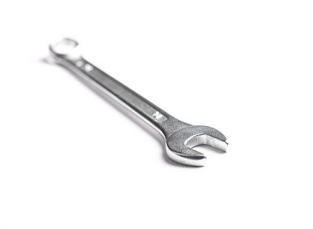 Wrench and metallic spanner tools, steel equipment repair hardware for working industrial mechanical construction. Service object, background chrome white instrument.の写真素材