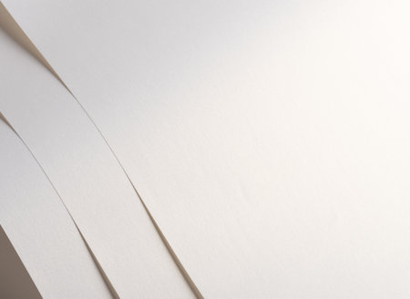 Sparkling, glittering white paper with a polished, silky texture. The bright, satiny surface features layered folds and geometric lines, creating a chic, classy design. Glowingの写真素材