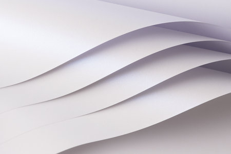 Glossy paper background with a white gradient, featuring a wavy, twisted texture and elegant curved lines. The abstract, crinkled surface offers a chic, stylish lookの写真素材
