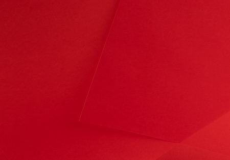Scarlet red paper background with a rich, vibrant gradient and smooth texture. Premium material with subtle shadows and an elegant monochrome design. Perfect for luxury overlays,の写真素材