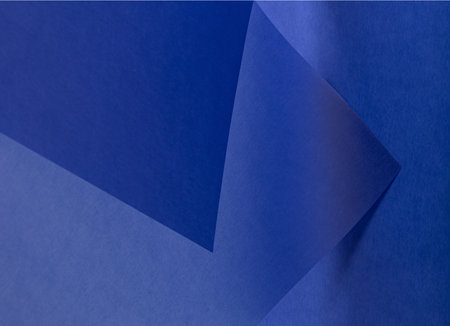 Rich royal blue tracing paper background with a matte finish and soft gradient. Featuring a grainy, translucent texture, it adds depth and elegance. Perfect for minimalist designs,の写真素材