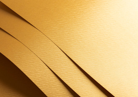 Golden yellow paper background with rippled, wavy metallic textures and overlapping layers. Smooth surfaces and vibrant warm tones create a polished, luxurious, and dynamic composition.の写真素材