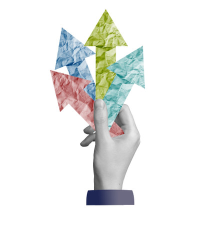 Opportunity and aspiration. A hand holding arrows pointing in different directions, representing progress, challenge, and ambition. Multi-option choices. Isolated on white background.の写真素材