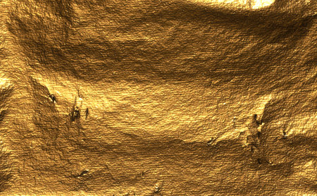 Golden foil with metallic texture, featuring wrinkles, creases, and scratches, creates a reflective,...